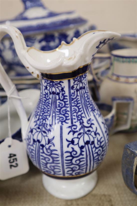 A group of 19th century blue and white pottery dishes, plates, jugs, together with an enamelled white stoneware jug